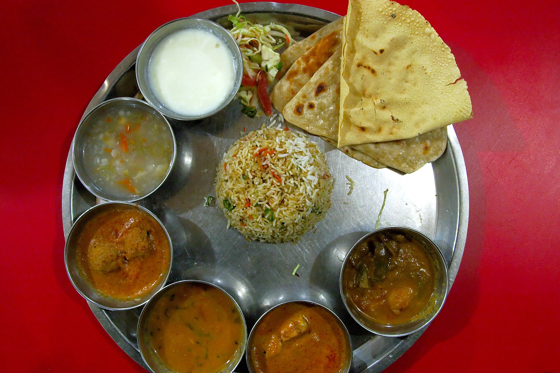 A thali meal in Darjeeling: rice, dal, curries and breads on one tray